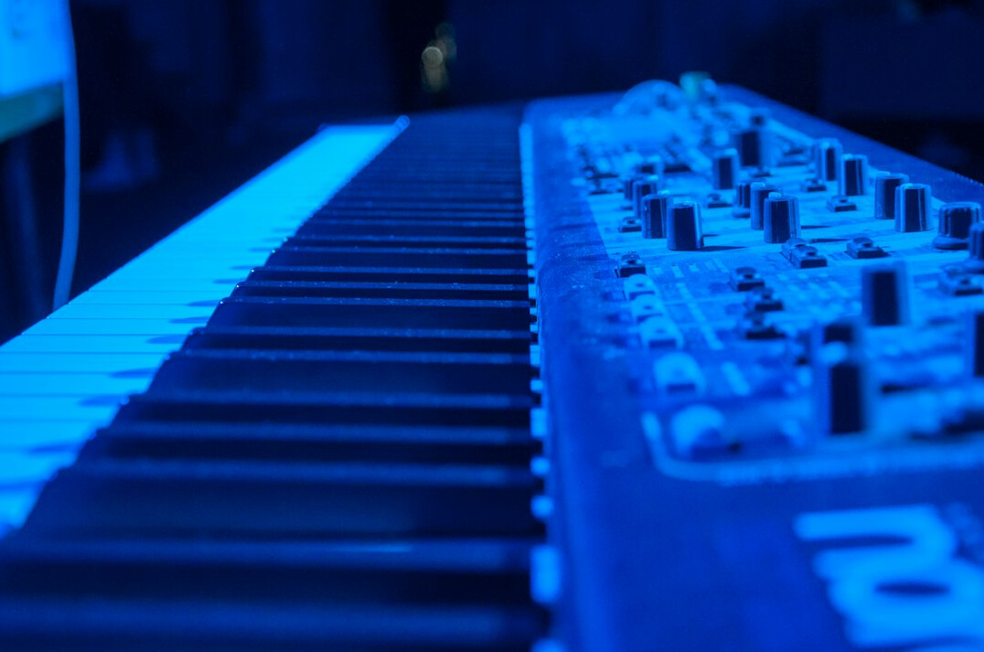 Dark keyboard lit by blue light