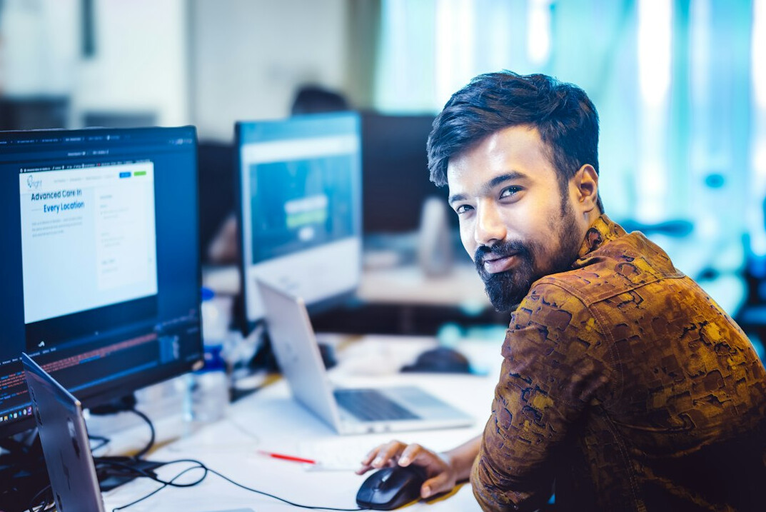 successful programmer smiling