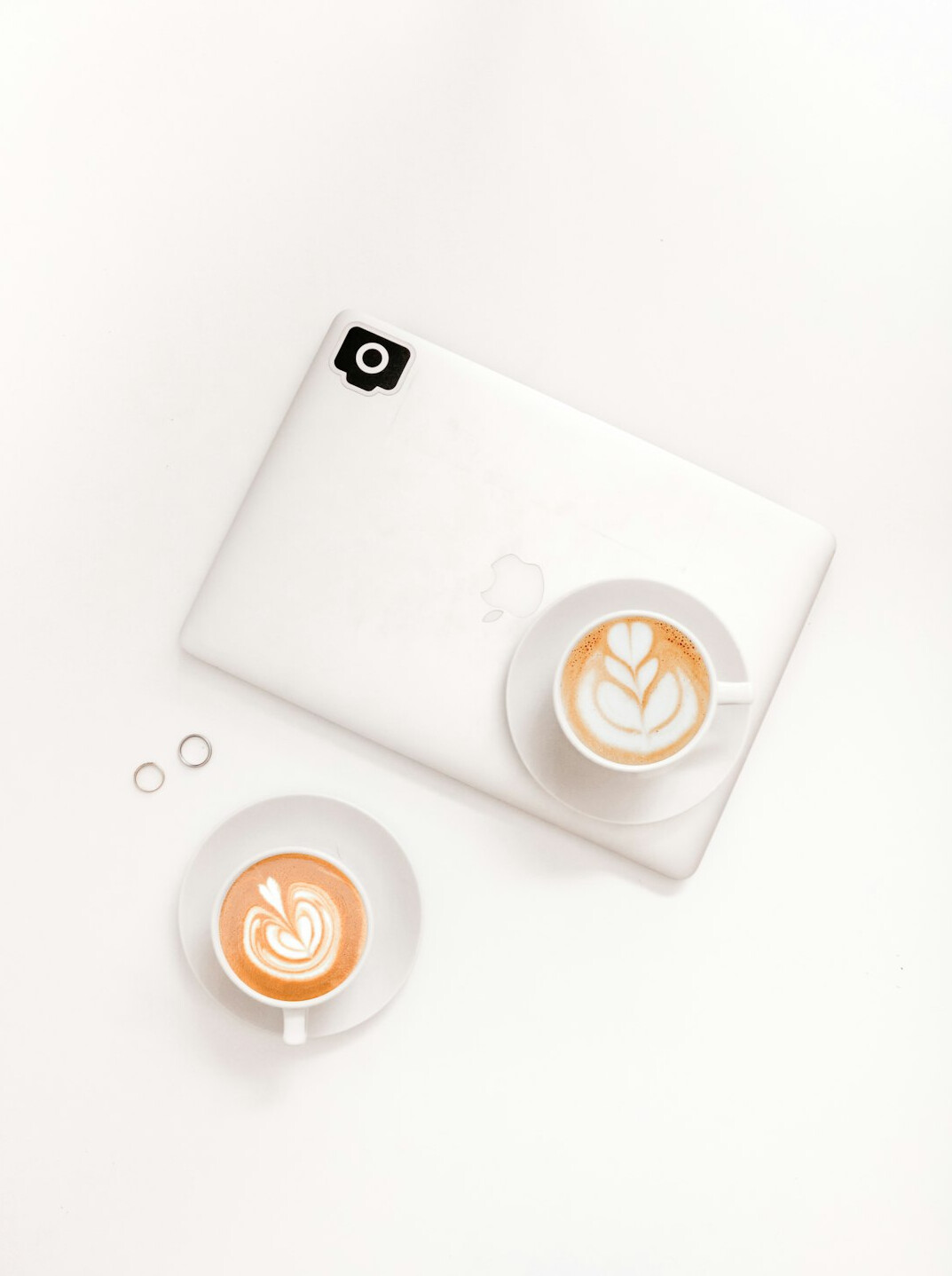 Laptop with code and a cup of coffee
